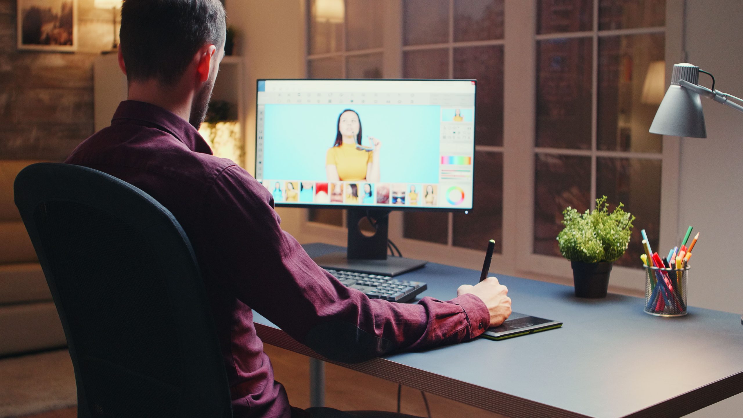 male-photographer-editing-photos-office-night-time-using-graphic-tablet (1)